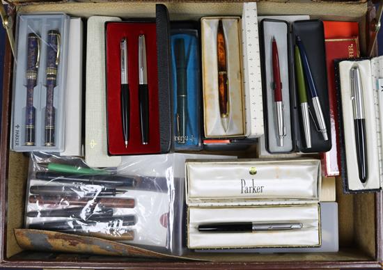 A collection of fountain pens including Parker 51 and 61 in vintage leather briefcase